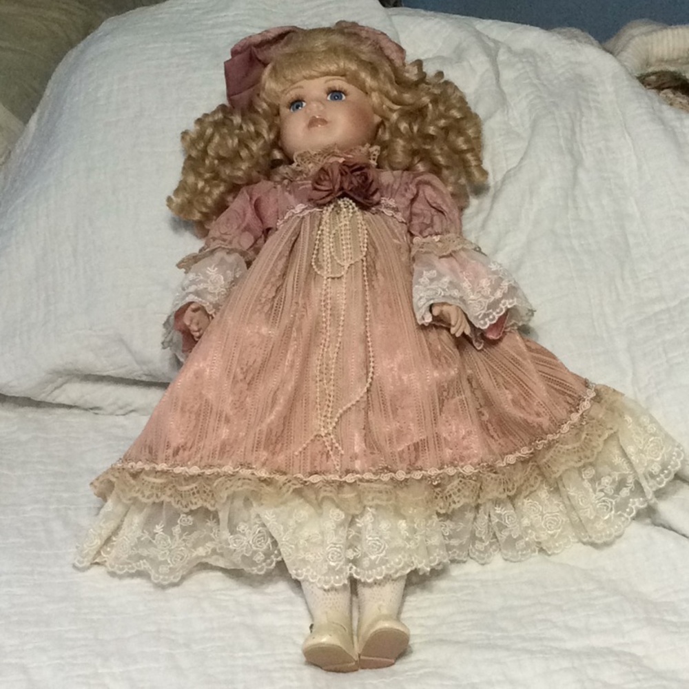22” porcelain doll. H133